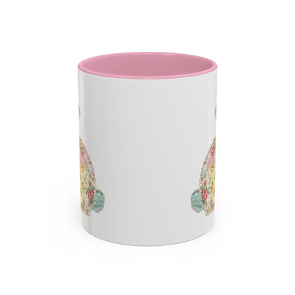 White ceramic mug with pink interior and handle, featuring a soft patchwork floral Easter bunny design.