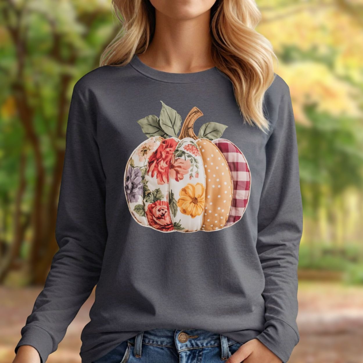 Charcoal long-sleeve tee with a colorful faux patchwork pumpkin featuring floral, plaid, and polka dot patterns.
