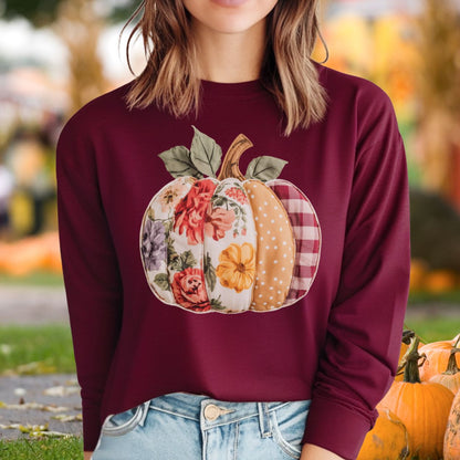 Maroon long sleeve tee with a faux patchwork pumpkin design featuring floral, gingham, and dotted patterns.