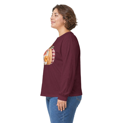 Woman in a maroon long-sleeve tee with a floral and plaid faux patchwork pumpkin design.