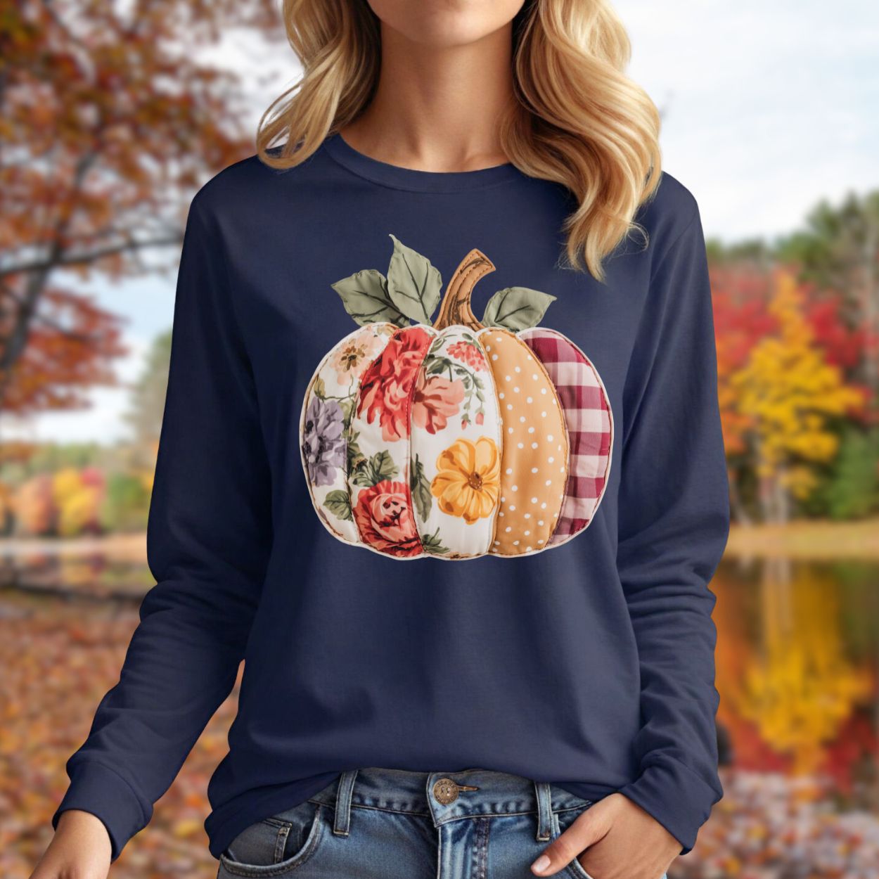 Navy long sleeve tee with a faux patchwork pumpkin featuring floral, gingham, and dotted patterns.