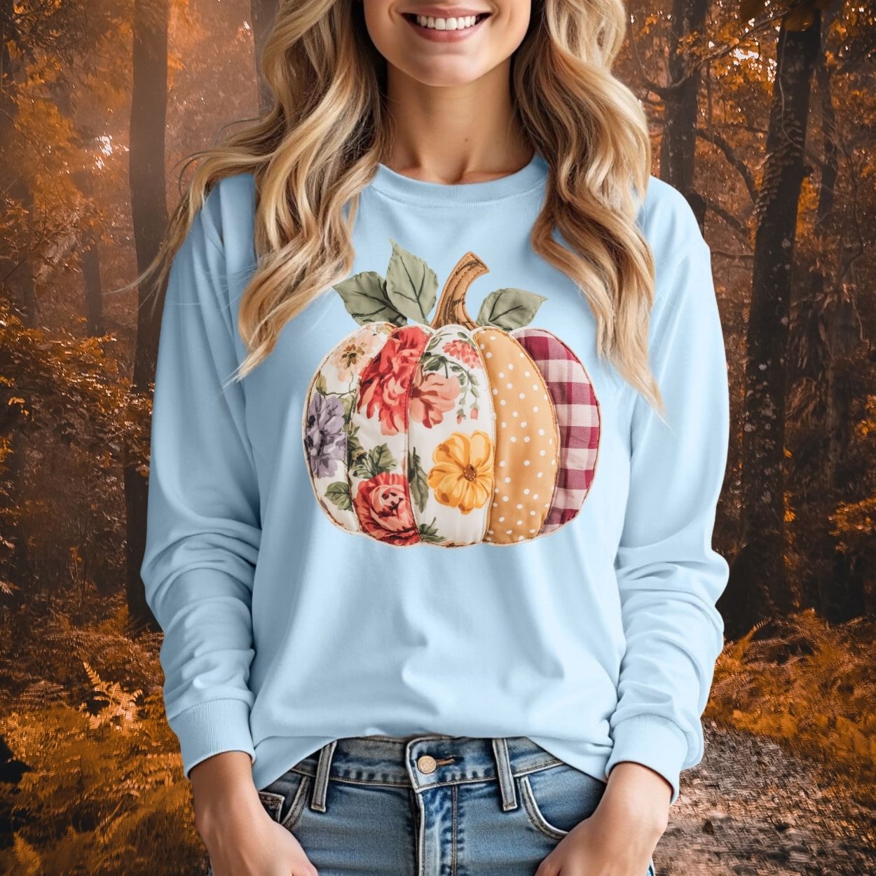 Light blue long sleeve tee with a colorful faux patchwork pumpkin featuring floral, gingham, and polka dot patterns.