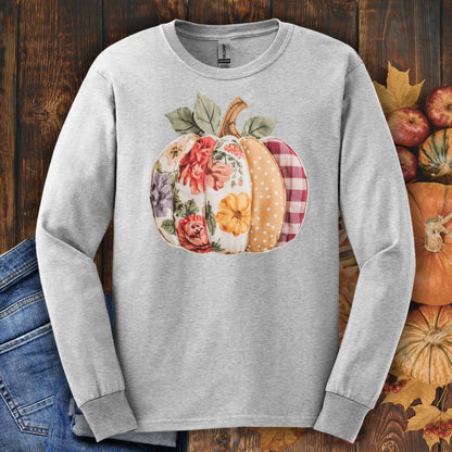 Ash long sleeve tee with a faux patchwork pumpkin featuring floral, gingham, and dotted patterns.