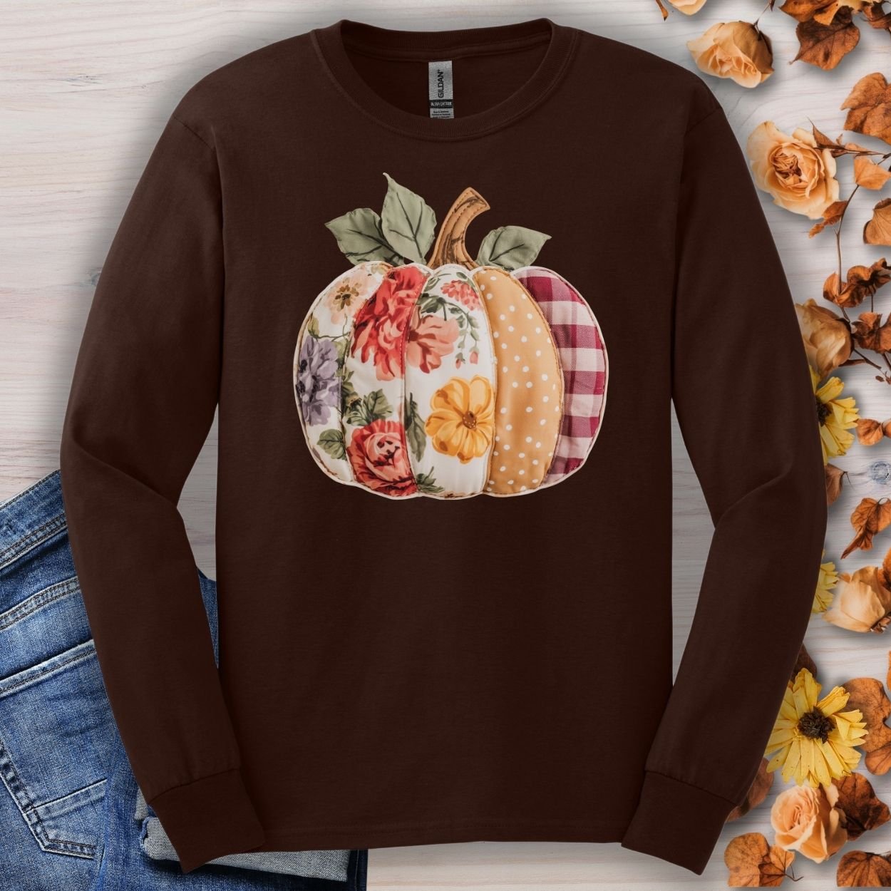 Dark chocolate long sleeve tee with a faux patchwork pumpkin featuring floral, gingham, and polka dot patterns.