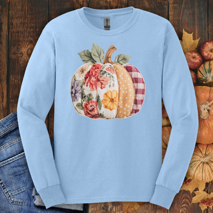 Light blue long sleeve tee with a faux patchwork pumpkin featuring floral, gingham, and dotted patterns.
