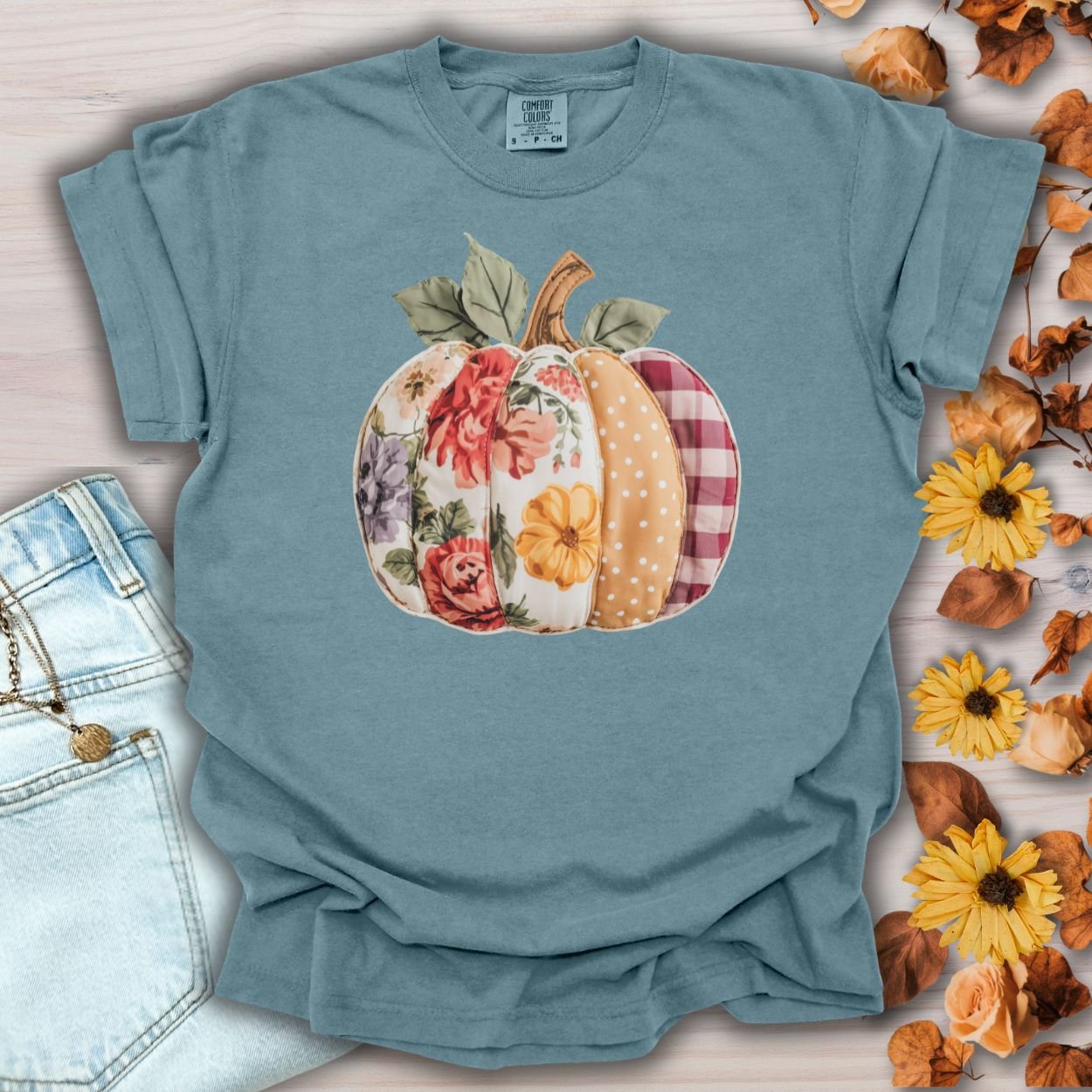 Ice Blue Comfort Colors tee with a faux patchwork pumpkin in floral, plaid, and polka dot patterns.