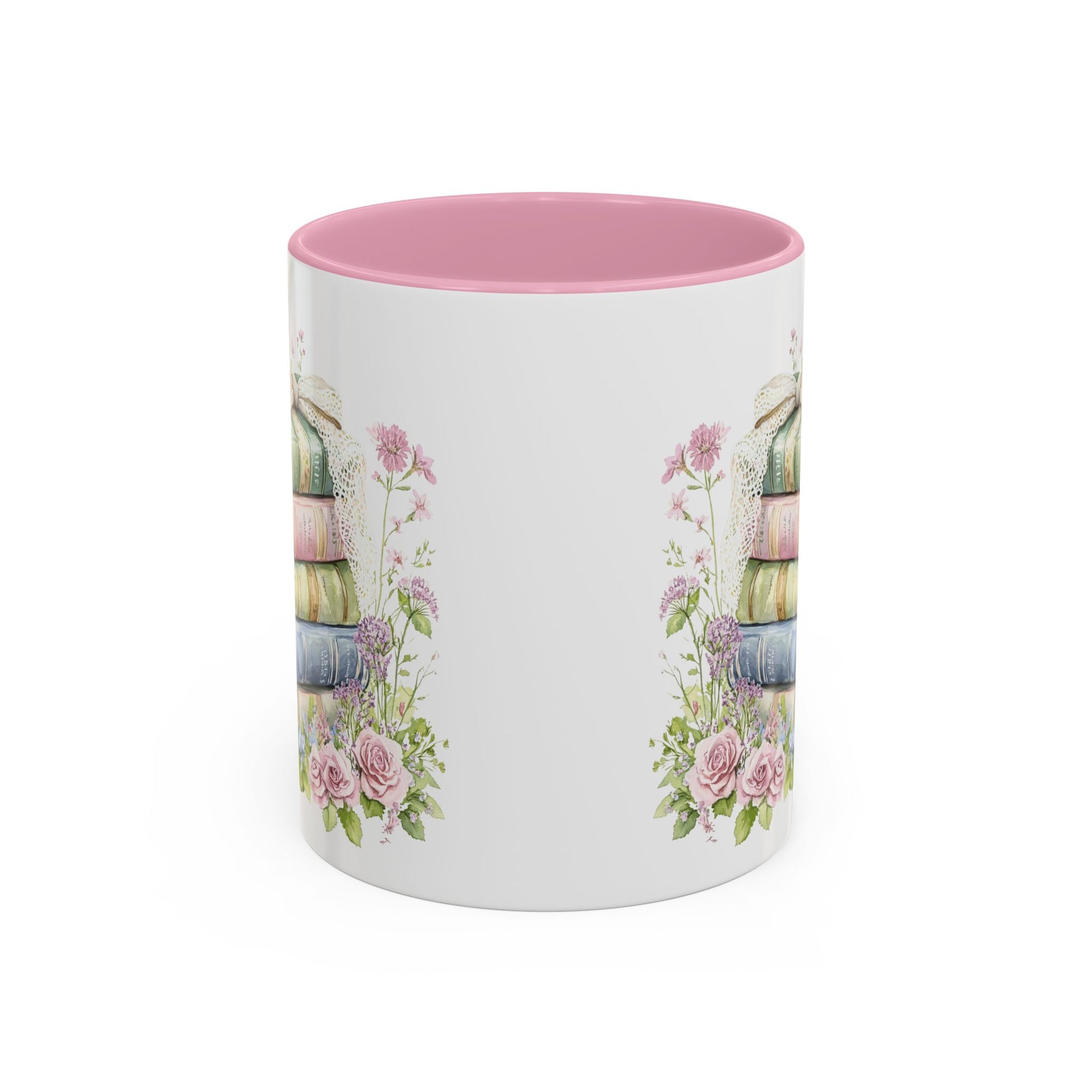 Glossy ceramic mug with pink interior, vintage book stack, and delicate floral watercolor design.