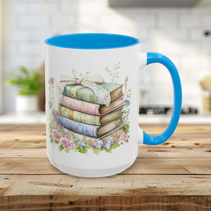 15oz glossy ceramic mug with a light blue interior and handle, featuring a vintage floral book stack design.