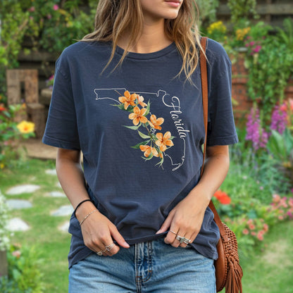 Garment-dyed navy t-shirt with a white outline of Florida, orange blossoms, and "Florida" script.