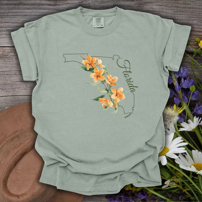 Bay S garment-dyed t-shirt with Florida state outline, orange blossoms, and "Florida" script.