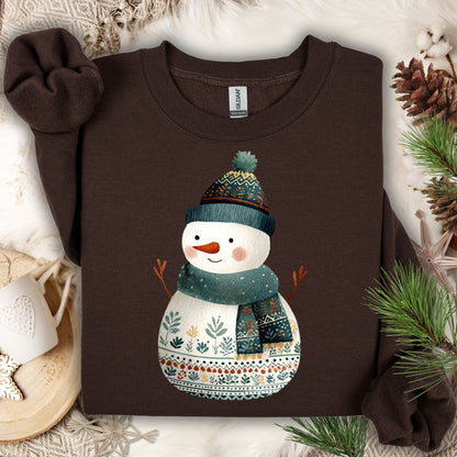 Dark Chocolate Gildan crewneck sweatshirt with a folk art snowman in a teal hat and scarf.