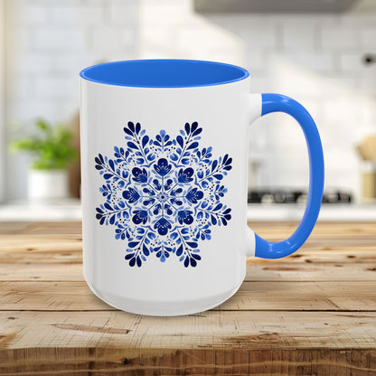 15oz white ceramic mug with Cambridge blue interior/handle and a detailed blue floral snowflake mandala.