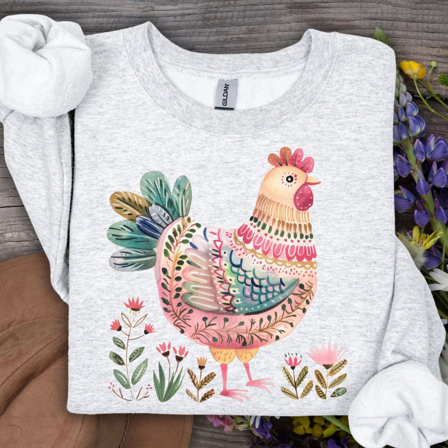 Ash gray sweatshirt with a colorful folk art chicken and floral design.
