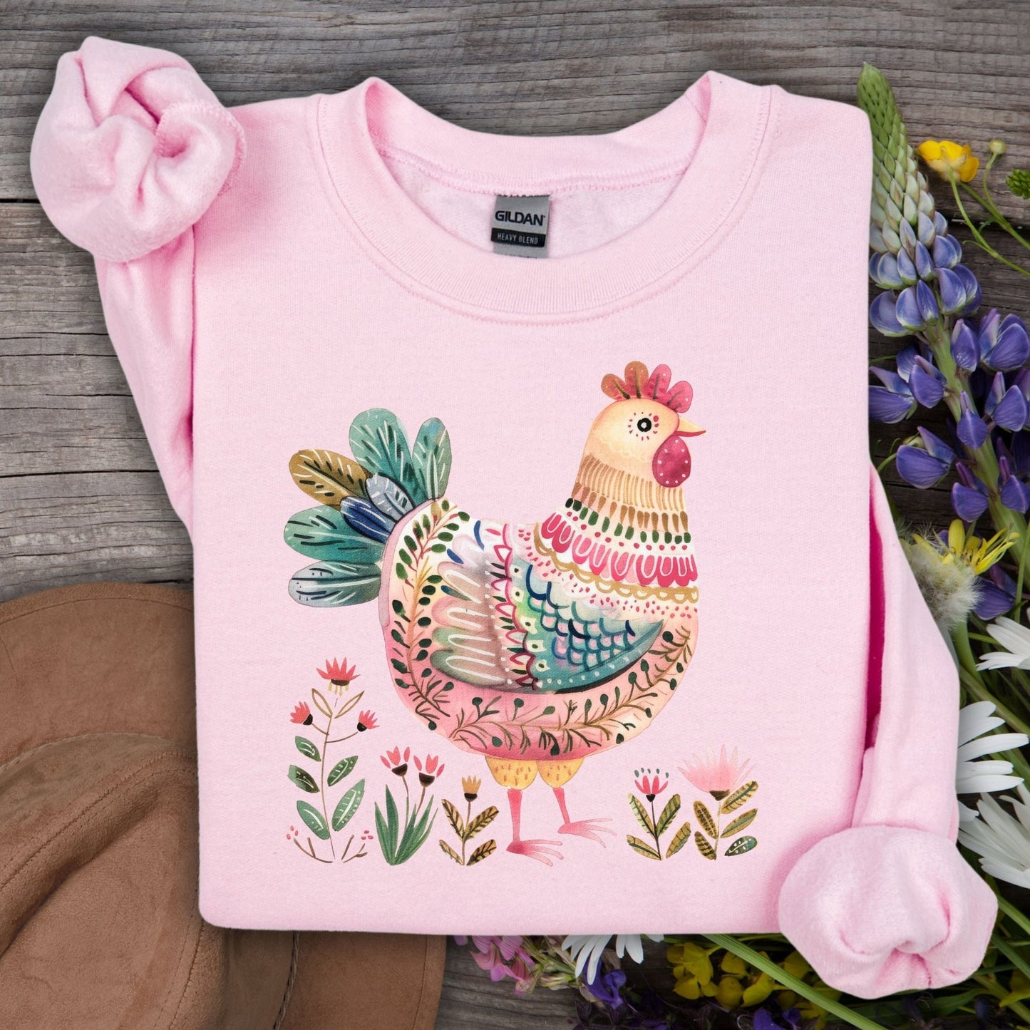 Light pink Gildan sweatshirt with a colorful folk art chicken and floral design.