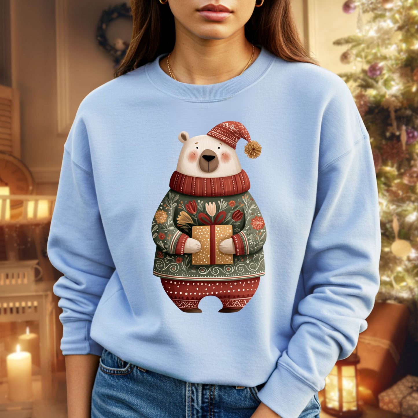 Light blue Gildan sweatshirt with a folk art polar bear in a fair isle sweater holding a gift.