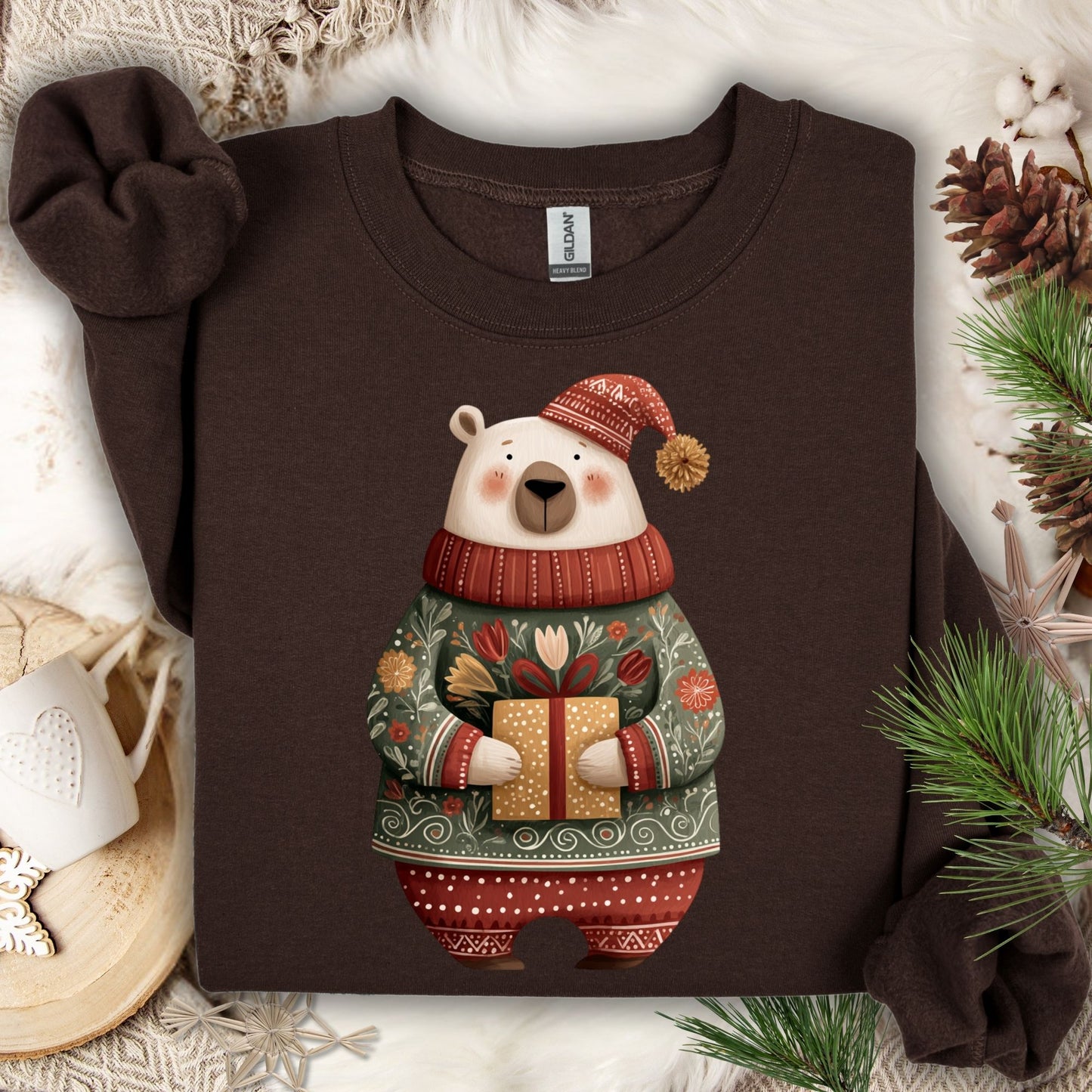 Dark Chocolate Gildan sweatshirt with a folk art polar bear in a fair isle sweater, holding a gift.