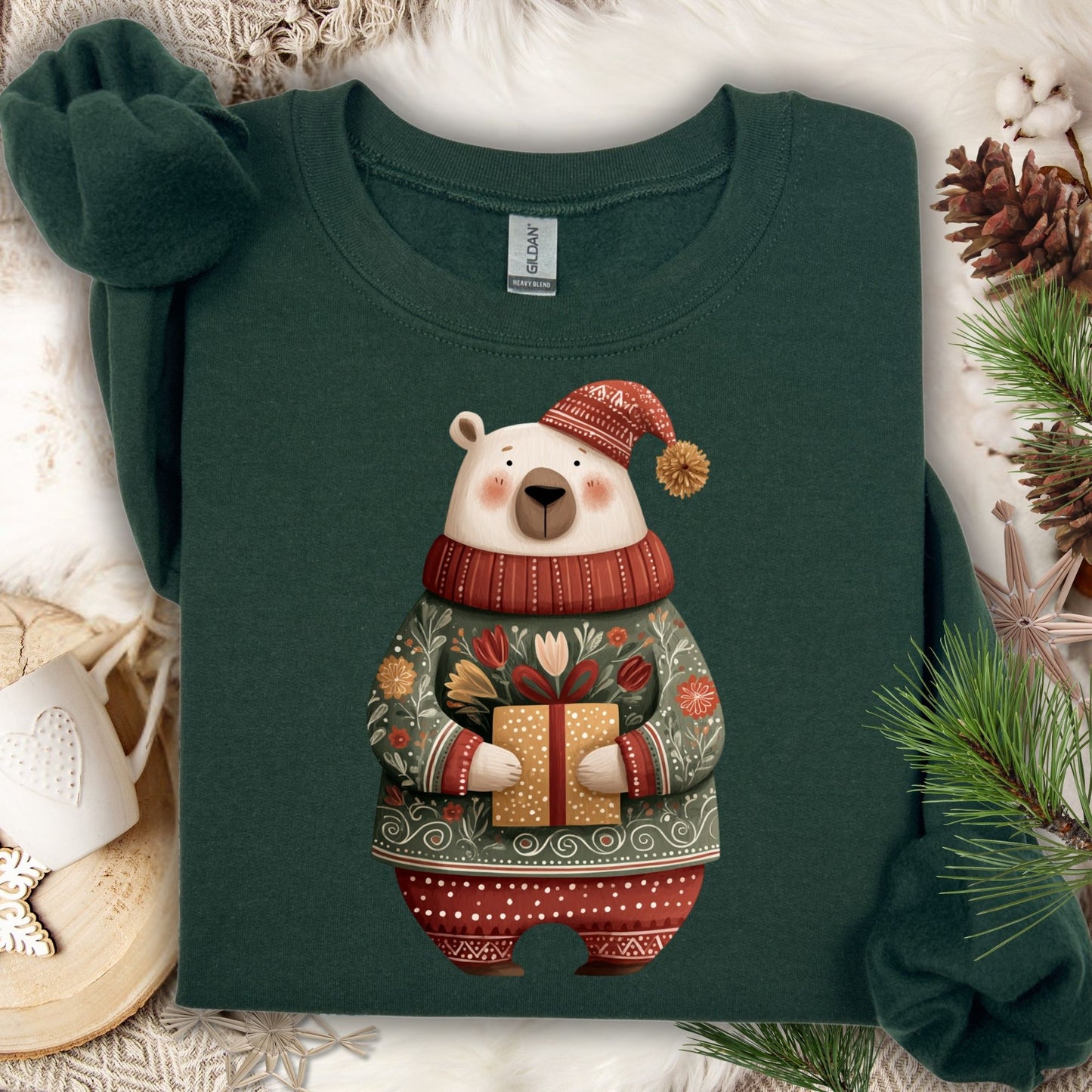 Forest Green Gildan crewneck sweatshirt with a folk art polar bear in a fair isle sweater, holding a gift.