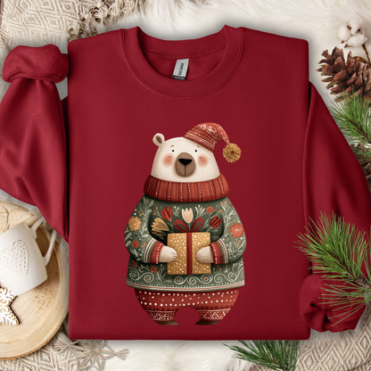 Garnet Gildan sweatshirt with folk art polar bear in fair isle sweater, holding a gift.