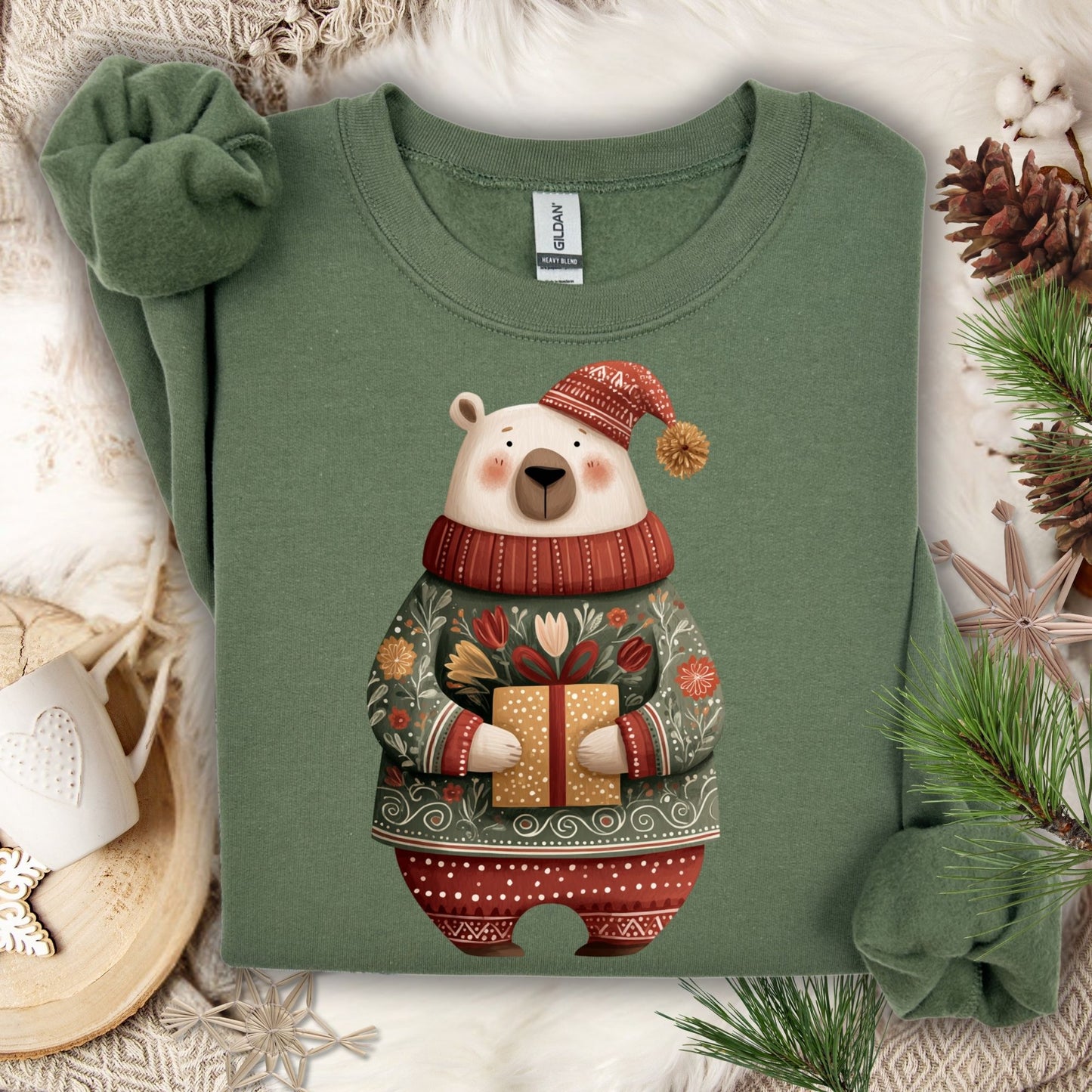 Military Green Gildan crewneck sweatshirt with a folk art polar bear in a fair isle sweater holding a gift.