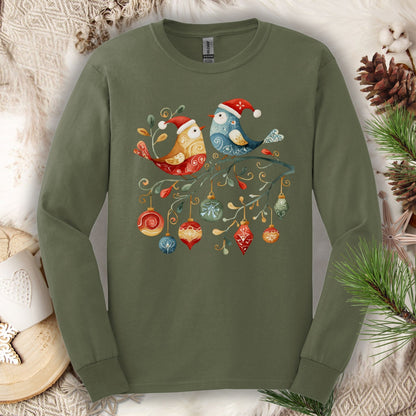 Military green long sleeve tee with folk art sparrow and bluebird in Santa hats on a festive branch with ornaments.