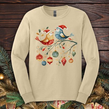Sand long sleeve tee with folk art sparrow and bluebird in Santa hats on a branch with Christmas ornaments.
