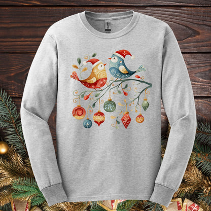 Ash gray long sleeve tee with folk art sparrow and bluebird in Santa hats on a festive branch with ornaments.
