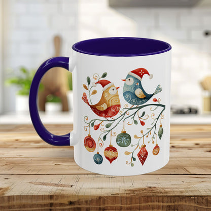Glossy ceramic mug with folk art Christmas birds, ornaments, and a purple handle/interior.