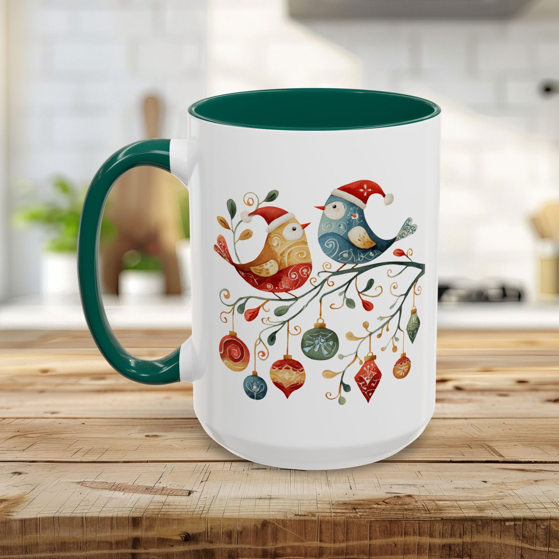 White ceramic mug with green handle and interior, featuring two folk art Christmas birds on a branch.