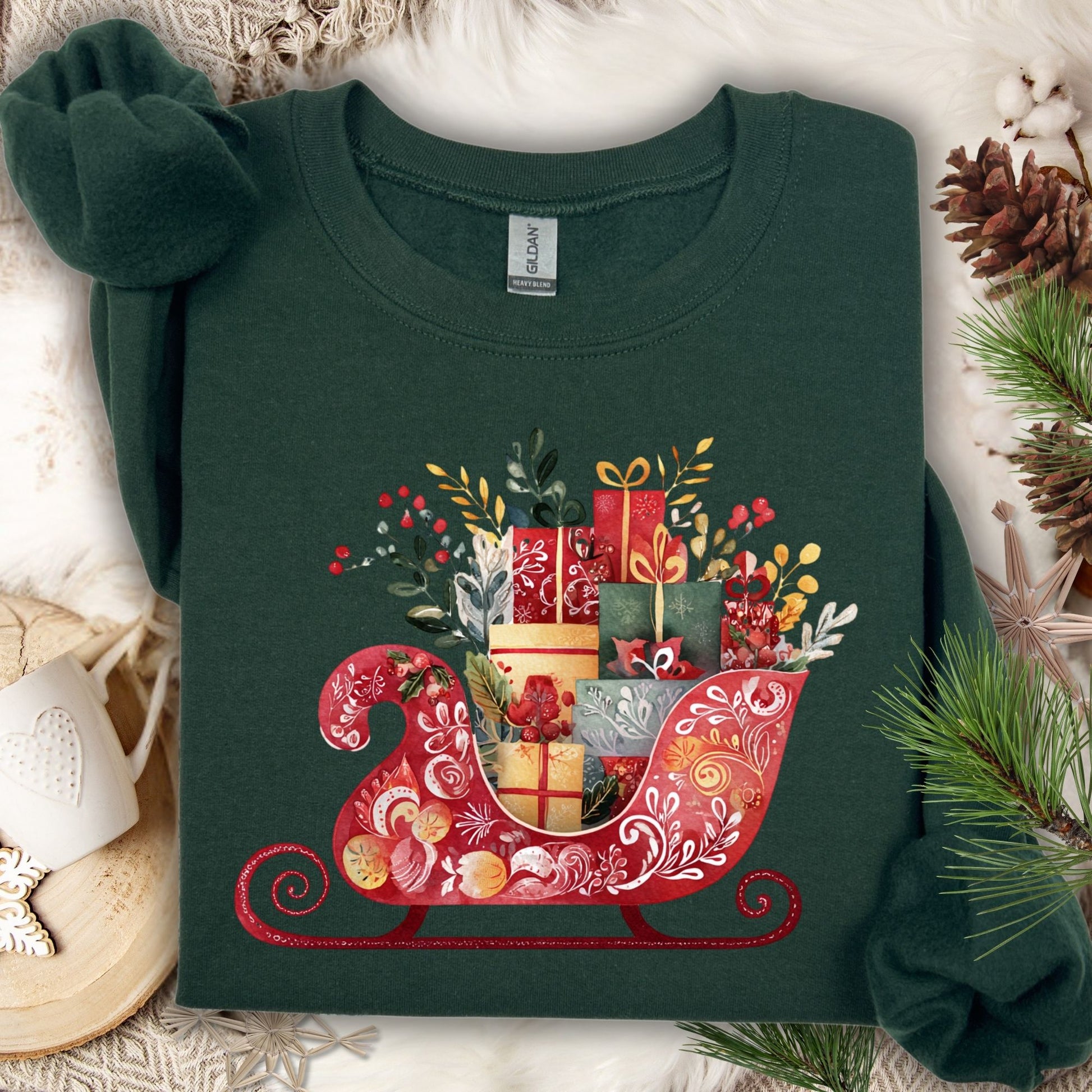 Forest green Gildan crewneck sweatshirt with folk art Santa's sleigh brimming with gifts.