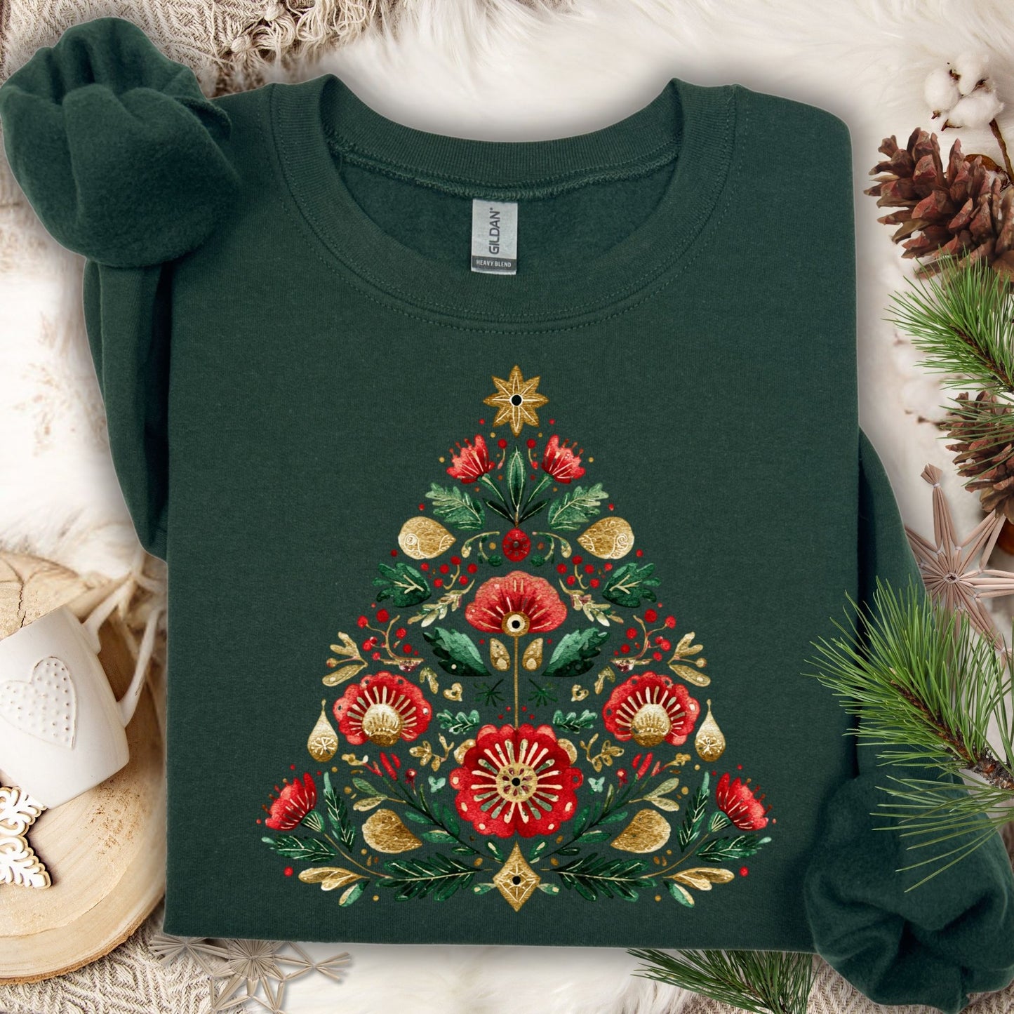 Forest green Gildan sweatshirt with a folk art Christmas tree design in red, green, and gold.