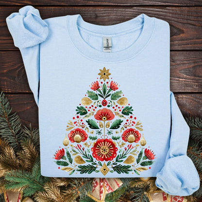 Light blue Gildan sweatshirt with a folk art Christmas tree design in red, green, and gold.