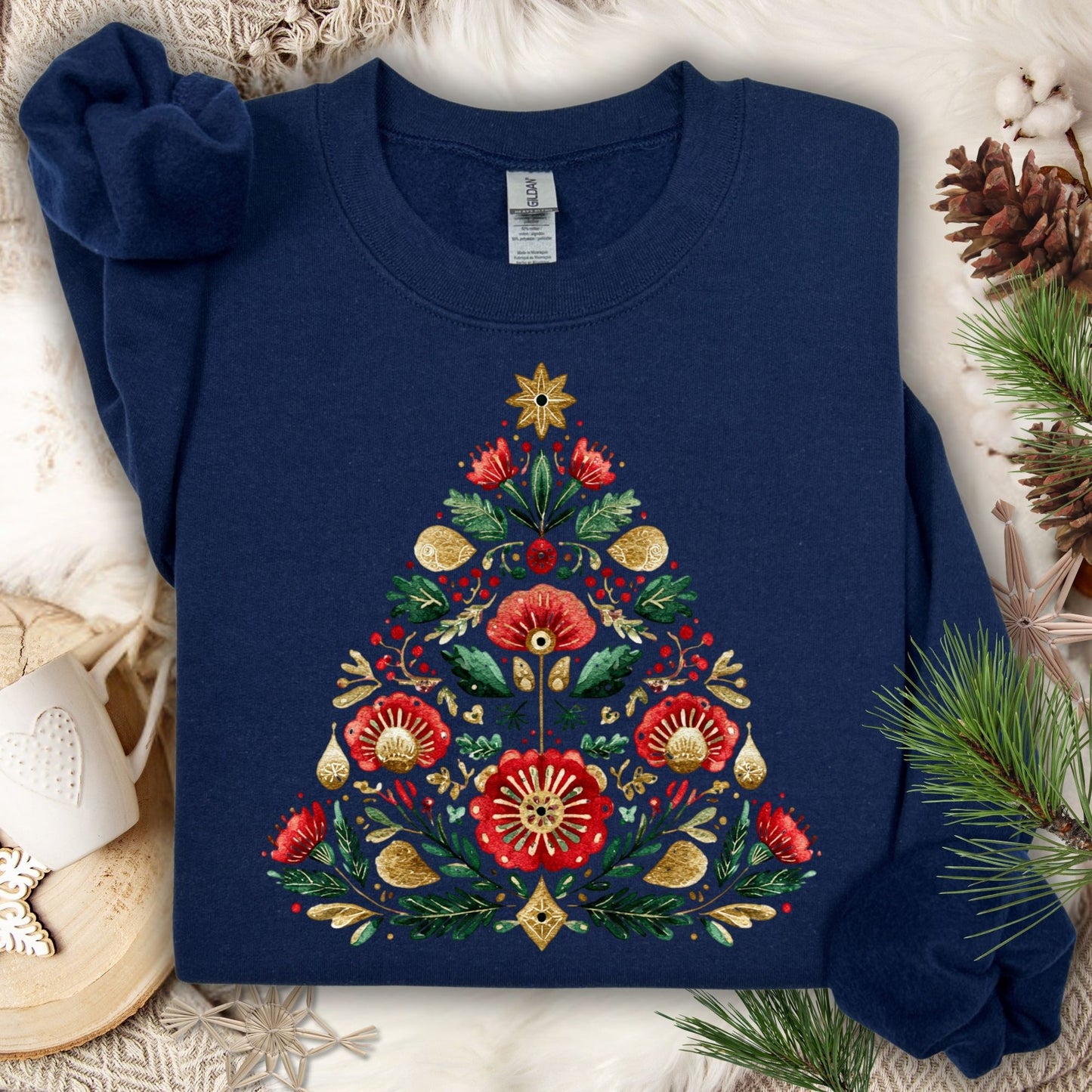 Navy Gildan sweatshirt with a folk art Christmas tree design in red, green, and gold.