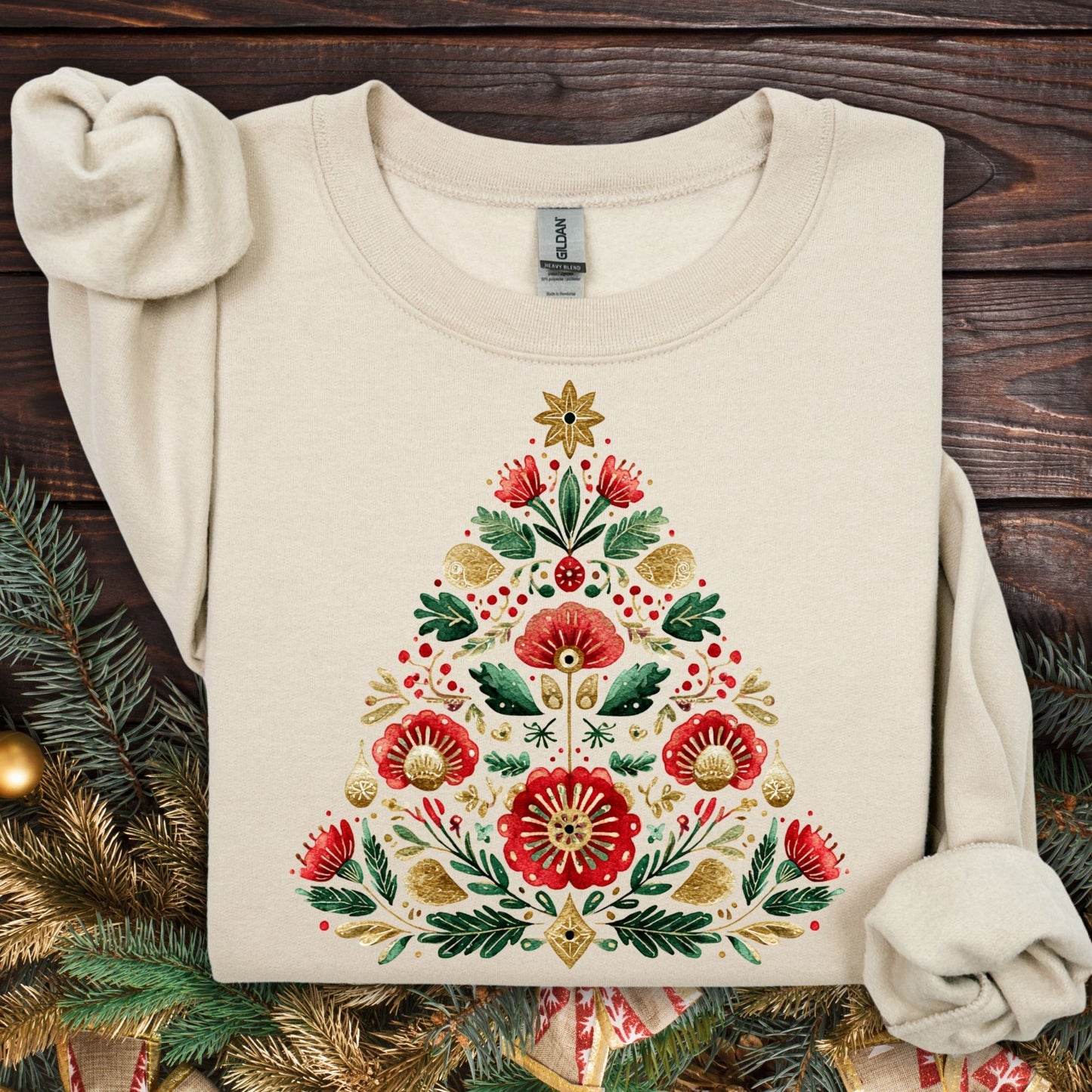 Sand Gildan sweatshirt with a folk art Christmas tree in red, green, and gold.