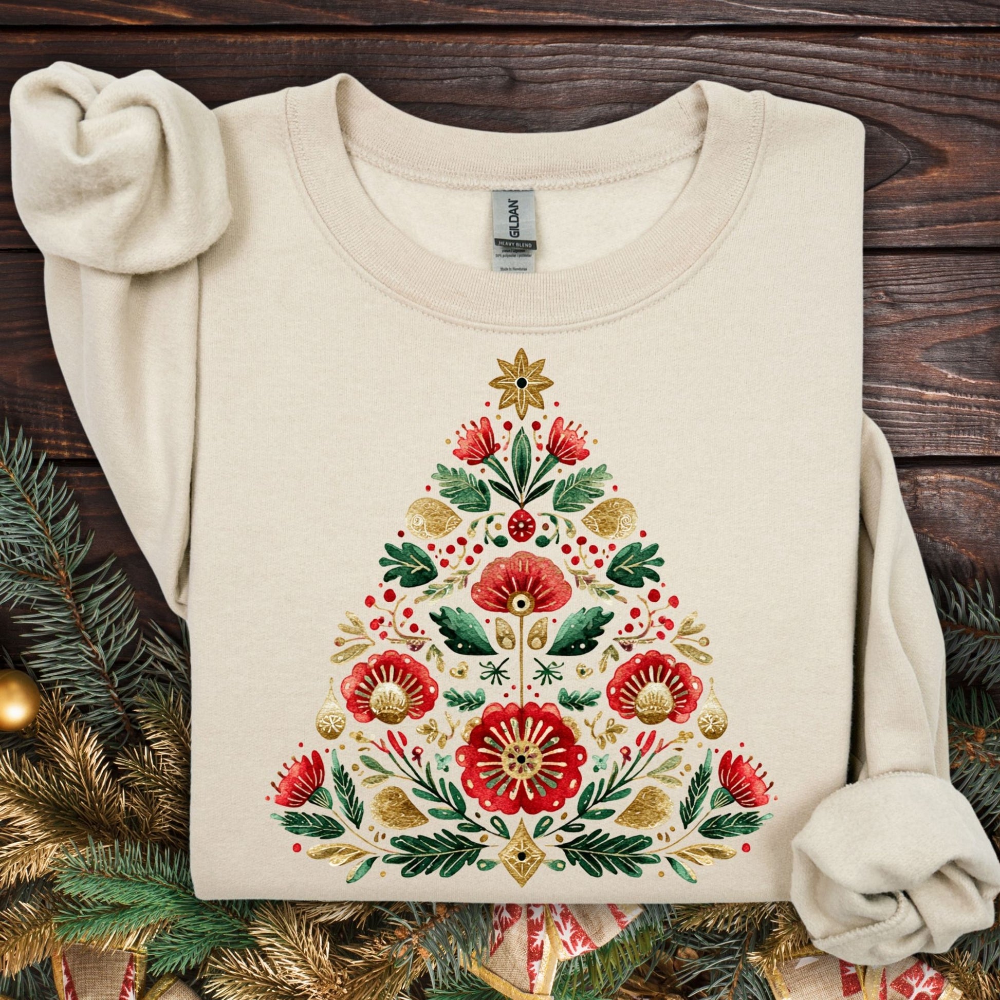 Sand Gildan sweatshirt with a folk art Christmas tree in red, green, and gold.