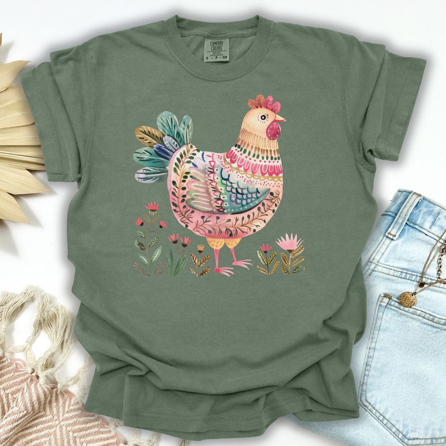 Moss green S-size cotton t-shirt with a colorful folk art hen and garden motifs.