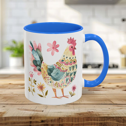 11oz ceramic mug with a colorful watercolor rooster and floral design, featuring a Cambridge Blue interior and handle.