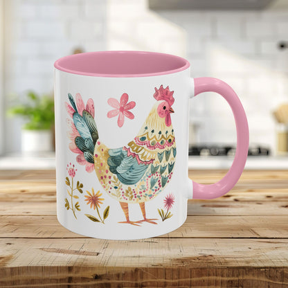 11oz ceramic mug with a whimsical watercolor rooster, floral accents, and a pink interior and handle.