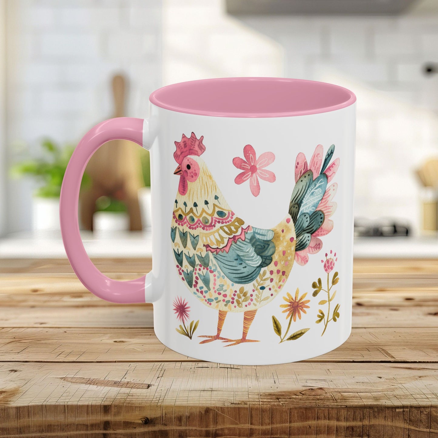 White ceramic mug with a pink handle and interior, featuring a colorful watercolor folk art rooster and floral design.