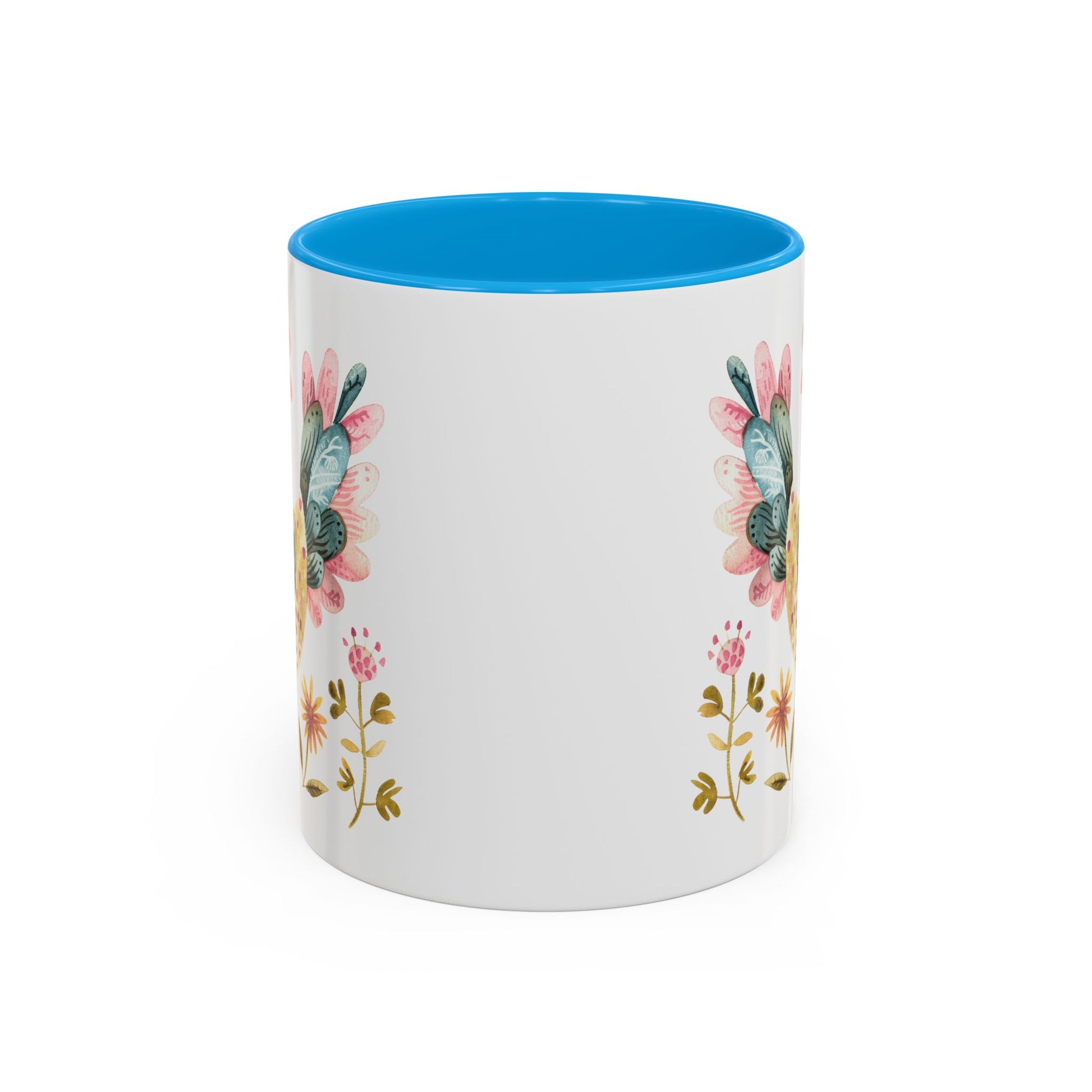 White ceramic mug with blue interior, featuring watercolor folk art flowers on the sides.