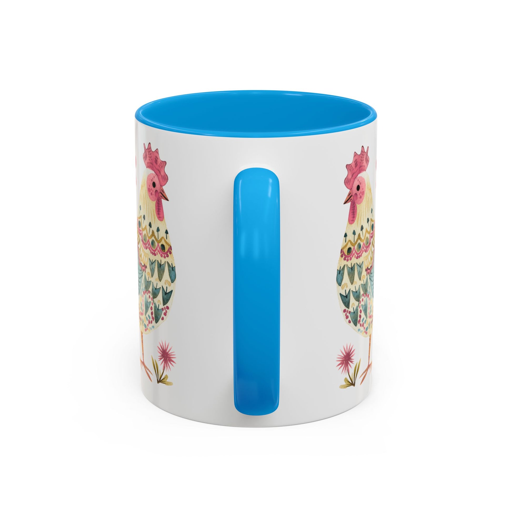 White ceramic mug with blue interior and handle, featuring a colorful folk art watercolor rooster design.