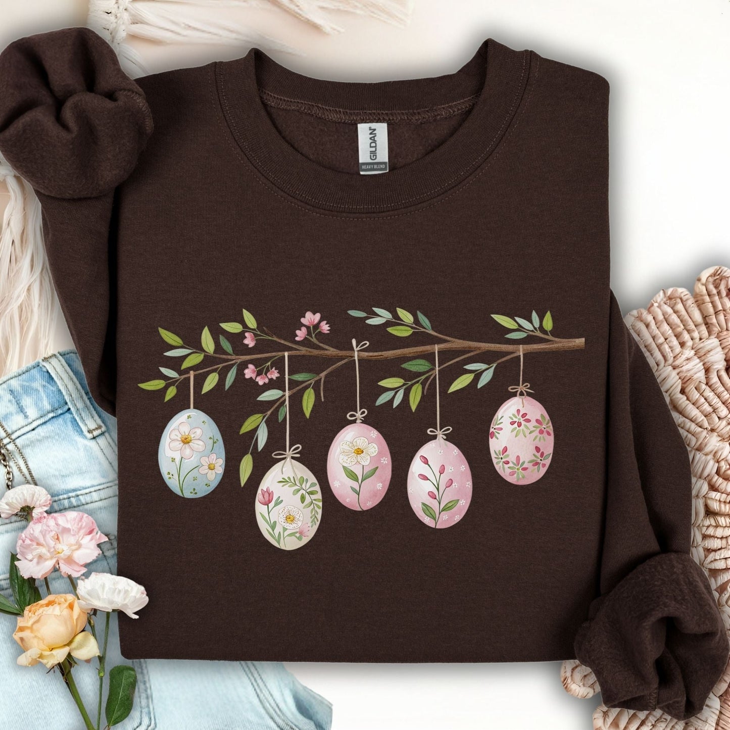 Dark chocolate sweatshirt with a folk art Easter egg branch design featuring watercolor floral eggs.