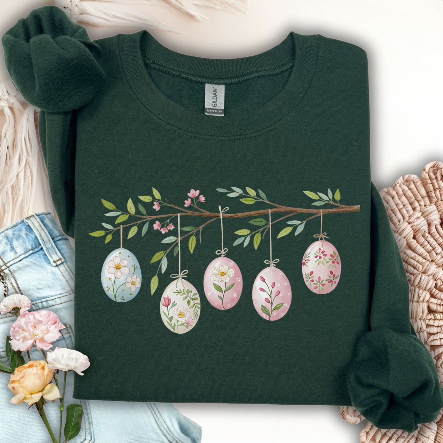 Forest Green S sweatshirt with a folk art Easter egg branch design featuring watercolor botanical eggs.