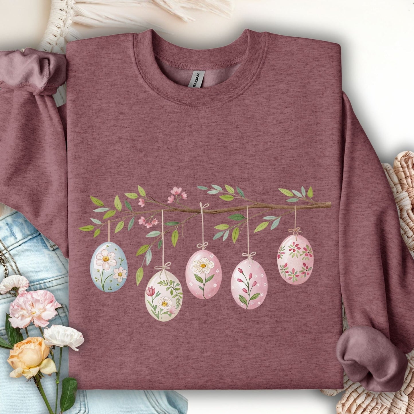 Heather Sport Dark Maroon sweatshirt with watercolor folk art Easter eggs on a floral branch.