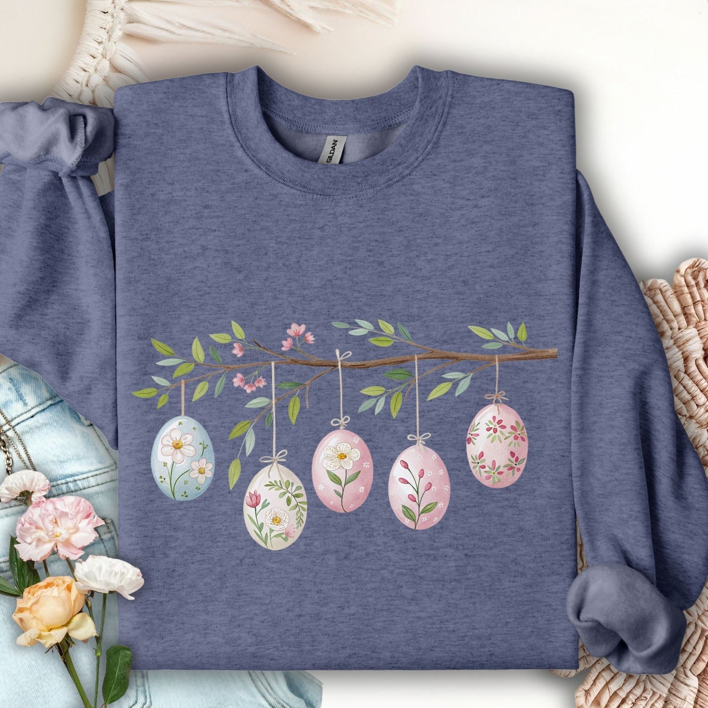Heather Sport Dark Navy sweatshirt with a folk art Easter egg branch design featuring watercolor botanical eggs.
