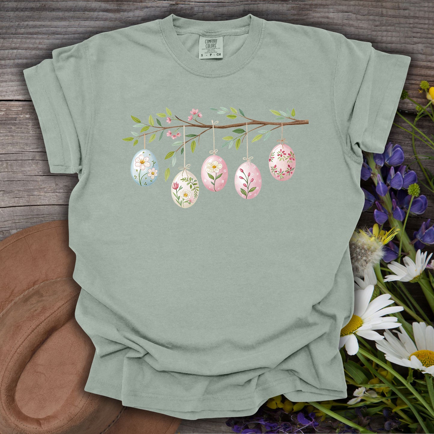Bay green relaxed-fit t-shirt with a folk art Easter egg branch design.