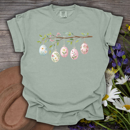 Bay green relaxed-fit t-shirt with a folk art Easter egg branch design.