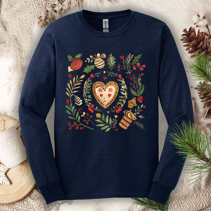 Navy long sleeve tee with folk art gingerbread heart, holly, and vintage baking design.