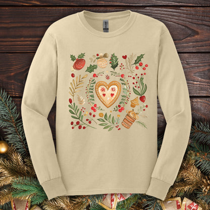 Sand Gildan Softstyle long sleeve tee with folk art gingerbread heart, holly, and vintage baking design.