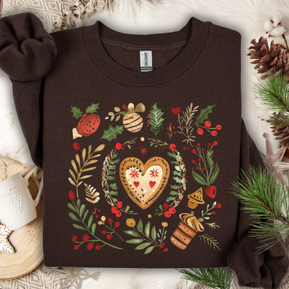 Dark chocolate Gildan sweatshirt with folk art gingerbread heart, holly, and berries design.