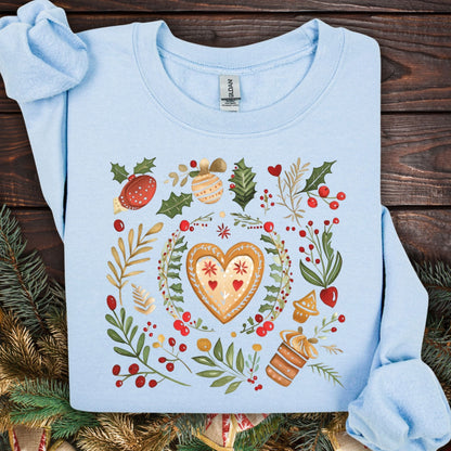 Light blue fleece sweatshirt with folk art gingerbread heart, holly, and red berry design.